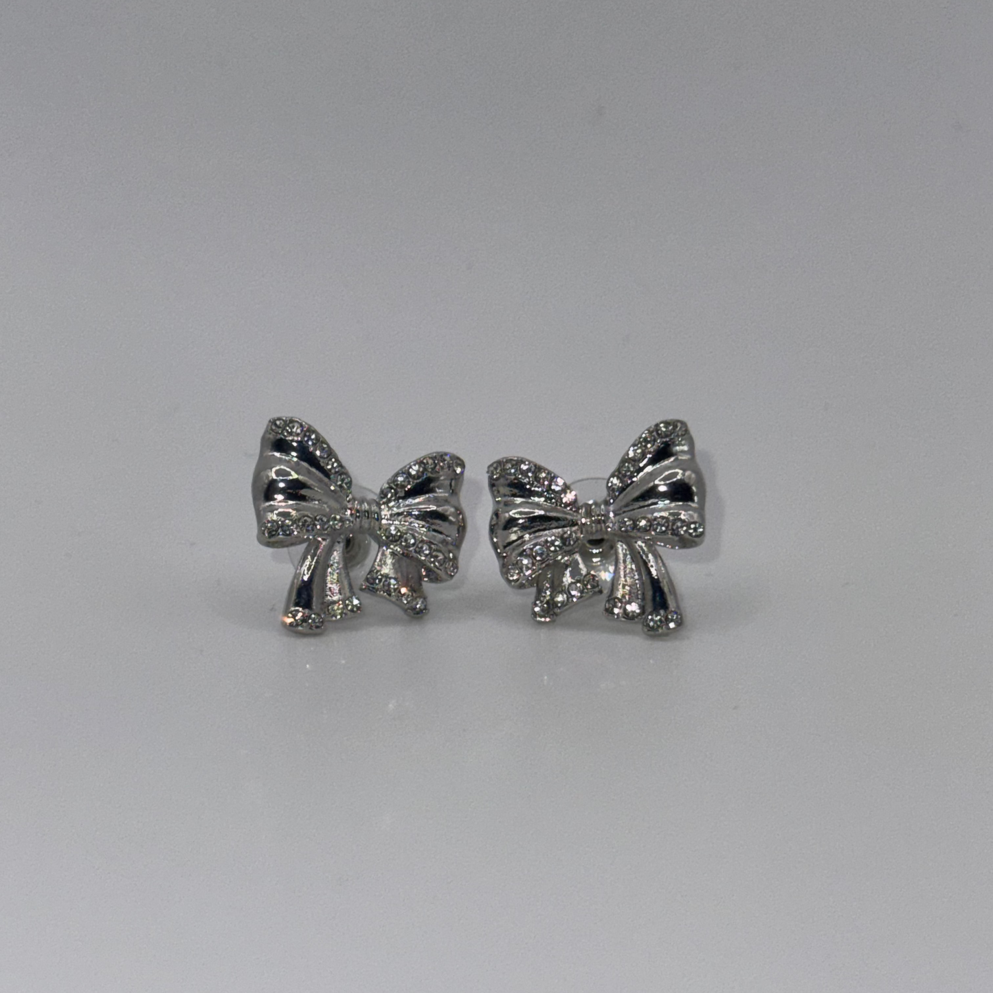 SilverGlow Bow Earrings