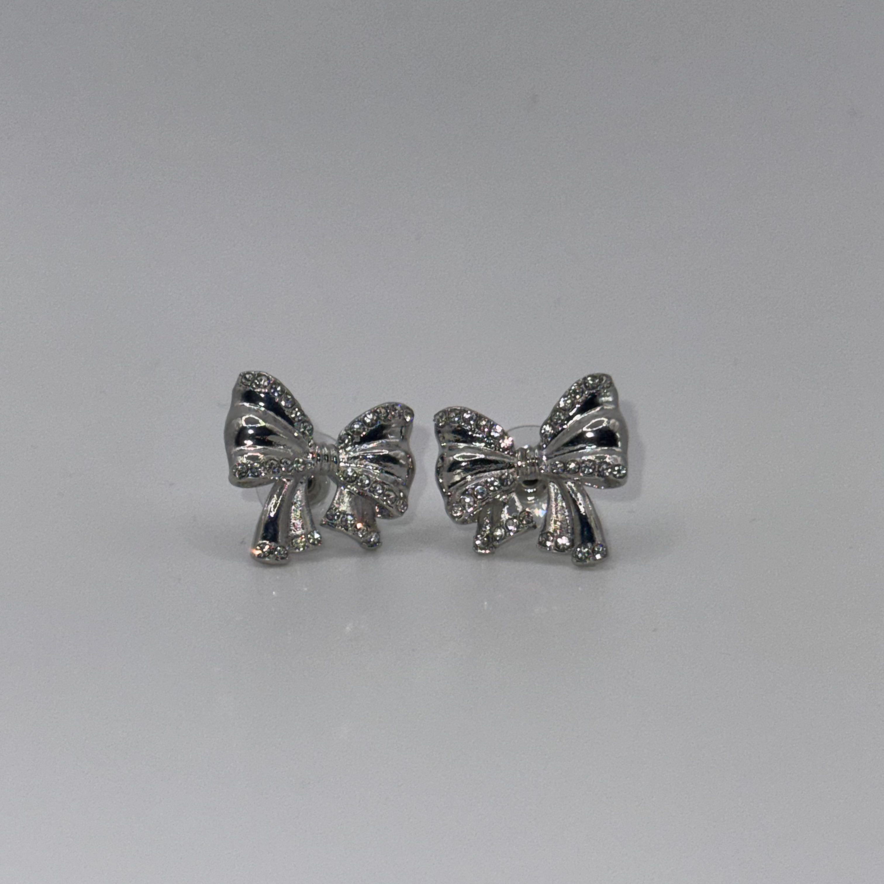 SilverGlow Bow Earrings